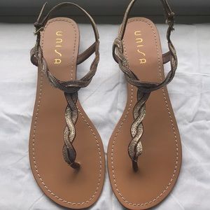 Gold, sparkly thong sandals. Unisa 11M.